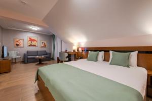 Rubicon Garni Hotel客房内的一张或多张床位