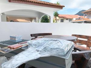 a picnic table with a sheet of tin foil on it at Langkawi Cozy Holiday Home at Bukit Indah by Zervin in Kuah