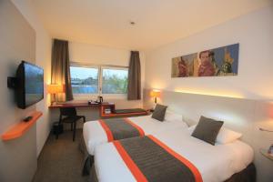 Postel nebo postele na pokoji v ubytování Best Western Colmar Expo