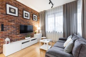Televízia a/alebo spoločenská miestnosť v ubytovaní Apartament Kornelówka - Rezydencja do Skoczni Zakopane + 17 fotografií