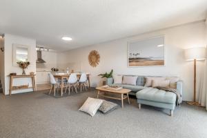 a living room with a couch and a table at Wintersview 8 - Lennox Head in Lennox Head