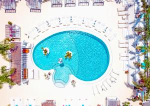 an aerial view of a swimming pool at a resort at Beach Star Ibiza in San Antonio Bay