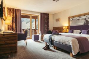 Ein Bett oder Betten in einem Zimmer der Unterkunft Hotel Kirchenwirt