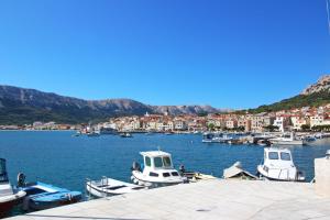 a bunch of boats are docked in a harbor at Apartments Rozanda in Baška