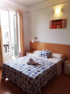 Postel nebo postele na pokoji v ubytování Hostal Felipe 2