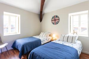 Postel nebo postele na pokoji v ubytování Les Toits de Marceau, Cœur cité historique Sarlat