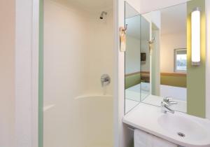 a bathroom with a sink and a mirror at ibis budget Birmingham Centre in Birmingham