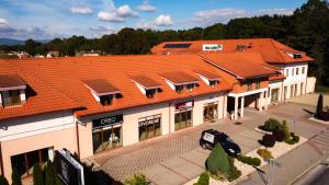 an overhead view of a building with an orange roof at Hotel Novy Kastiel - Self check-in in Topoľčany