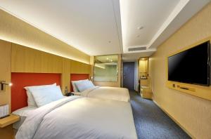 TV i/ili multimedijalni sistem u objektu Hotel Midcity Myeongdong