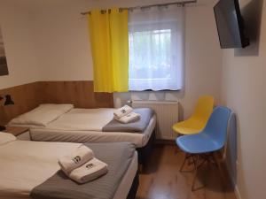 מיטה או מיטות בחדר ב-SZWEDZKA22 PL Premium Rooms