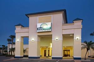 a building with a day inn sign on it at Days Inn by Wyndham Orlando Airport Florida Mall in Orlando