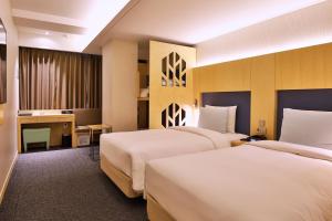 Krevet ili kreveti u jedinici u okviru objekta Hotel Midcity Myeongdong +37 fotografija