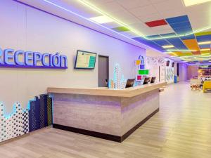 a reception counter in a hospital lobby at ibis budget Barranquilla in Barranquilla