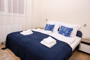 A bed or beds in a room at Kincses Sziget Apartman
