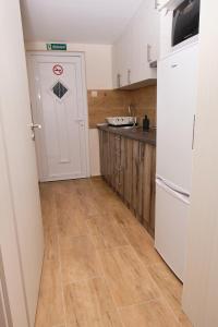 A kitchen or kitchenette at Kincses Sziget Apartman