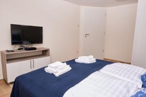 A bed or beds in a room at Kincses Sziget Apartman