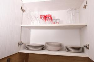 A kitchen or kitchenette at Kincses Sziget Apartman