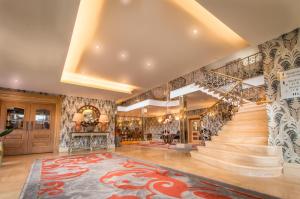 a home with a staircase and a lobby with a staircase at Grosvenor Pulford Hotel & Spa in Pulford