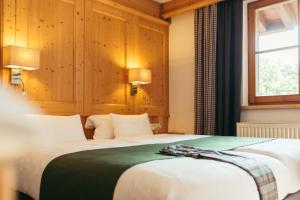Ein Bett oder Betten in einem Zimmer der Unterkunft Hotel Kirchenwirt