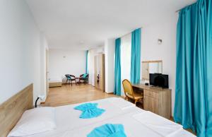 Postel nebo postele na pokoji v ubytování Hotel Elitza