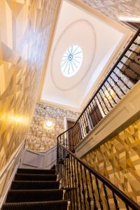 a staircase leading up to a stair case at Cairn Hotel & Apartments in Edinburgh