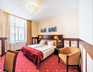 Postel nebo postele na pokoji v ubytování Rixwell Old Riga Palace Hotel