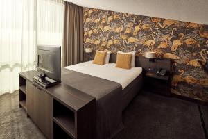 Postel nebo postele na pokoji v ubytování Van der Valk Hotel Leeuwarden