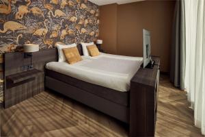 Postel nebo postele na pokoji v ubytování Van der Valk Hotel Leeuwarden