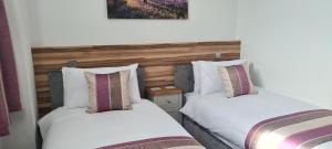 Postel nebo postele na pokoji v ubytování Escape Hotel