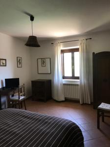 Postel nebo postele na pokoji v ubytování Appartamenti Il Capomandro + 37 fotografií