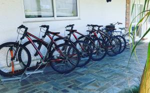 a row of bikes parked next to a wall at Villa dos Corcéis in Esposende