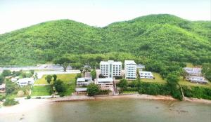 an aerial view of a resort next to a mountain at โรงแรม ชาโตว์วิสต้า in Chon Buri