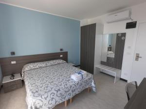 Postel nebo postele na pokoji v ubytování Hotel Aurora