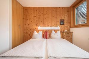 Rúm í herbergi á Försterhaus Wohnung Dachgeschoss