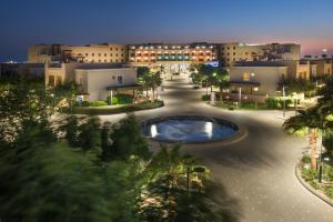 a view of a city at night at Alreem Village Hotel in Al Jubail