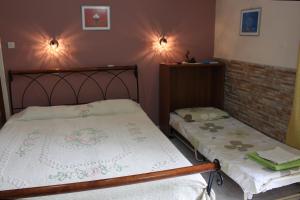 A bed or beds in a room at Villa Nefeli