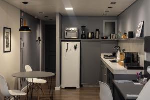 A cozinha ou cozinha compacta de Studio 107/Floripa - Estilo no coração da cidade
