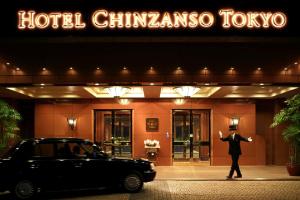 a man standing in front of a hotel at Hotel Chinzanso Tokyo in Tokyo