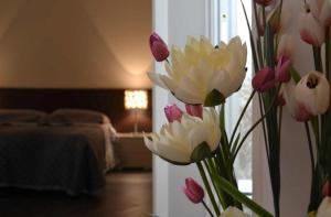 Posteľ alebo postele v izbe v ubytovaní Palazzo Ducale Suites