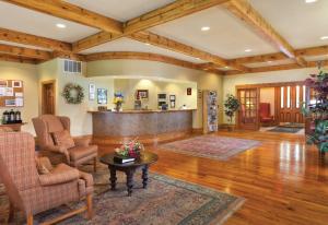 a large living room with wooden ceilings and wood floors at WorldMark Galena in Galena