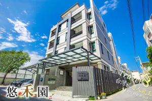 a building with a gate in front of it at Host Garden悠禾園 in Hualien City