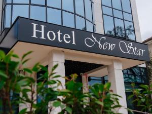 a hotel sign on the front of a building at Hotel New Star in Podgorica