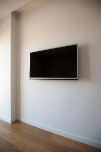 TV a/nebo společenská místnost v ubytování Costa Quebrada Apartamentos