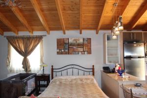 A bed or beds in a room at Villa Nefeli