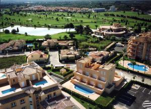 an aerial view of a resort with a large building at APARTAMENTOS PAR TRES - Oliva Nova in Oliva