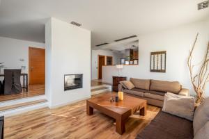 a living room with a couch and a table at Villa Ariadne in Ialysos