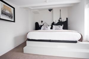 Ein Bett oder Betten in einem Zimmer der Unterkunft Boutique Hôtel Konfidentiel