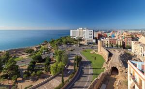an aerial view of a city and the ocean at H10 Imperial Tarraco 4 Sup in Tarragona