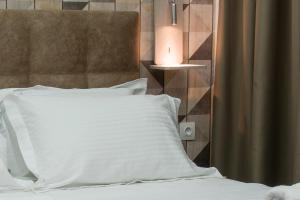 Posteľ alebo postele v izbe v ubytovaní Koios Apartments