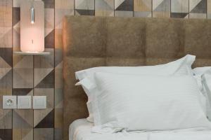 Posteľ alebo postele v izbe v ubytovaní Koios Apartments